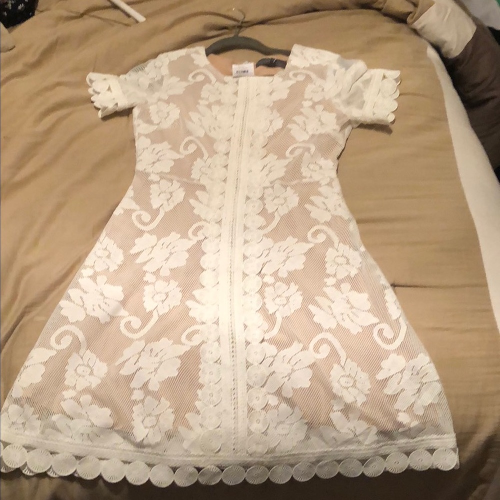 Ivory colored lace dress with nude lining